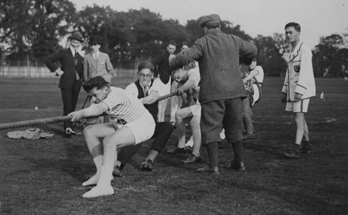 People taking part in tug of war News Article